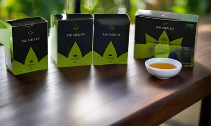 Tea packages with visible branding on a white background